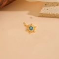 Golden sun pendant with blue opal and zircon stones on a natural wooden background - Blue Zircon Pendant / Gold