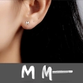 Minimalist S925 sterling silver M letter stud earring shown in a clear macro view - Letter M/Pair