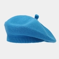 Detailed view of blue knitted beret showing fine texture and classic top stem detail - M / Lake Blue