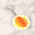 Miniature fried chicken wing food keychain on a white plate with realistic glossy finish - Mini Chicken Wing - Keychain