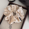 Oversized beige velvet scrunchie with black polka dots and a premium elegant texture - Beige Velvet Polka Dot Scrunchie