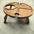 Detail of wooden folding picnic table featuring slots for wine bottles and wine glasses - Wine Style 29*29*17