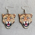 Detailed view of leopard-shaped wooden drop earrings with durable metal hooks - Leopard