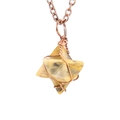 Macro detail of hand-wrapped copper wire on a natural stone Merkaba star pendant - Antique Copper + Crazy Lace Agate