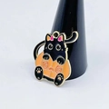 Cute Halloween black cat in pumpkin costume enamel charm with gold metal trim on display - Black Cat in Pumpkin