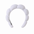 Close-up of white braided towel fabric headband with thick bubble texture for women - White Terry Headband