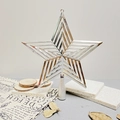 Close-up of a silver hollow star Christmas tree topper on a rustic stone surface - 15cm/21g / Silver