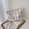 Detail of floral canvas pouch with simple wish label on a wooden tray with lace - White With Navy Blue Small Flowers