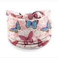 Light pink African print stretch headband featuring vibrant blue and red butterflies - Style 55