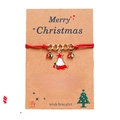 Christmas wish bracelet with red rope, golden chain, and Santa hat pendant on card - Christmas Hat