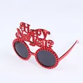 Red Happy New Year party glasses with decorative festive lettering and dotted frame design - Red New Year Glasses With Small Holes