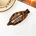Detail view of large oval matte leopard print hair claw clip on a white background - Matte Dark Leopard