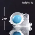 Luminous cartoon astronaut figurine in translucent white and blue side-lying pose - Side Lying Astronaut