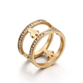 Golden titanium steel ring featuring hollow human silhouettes and paved white zircons - Gold Double Ring Figure Silhouette (KR44195-K)