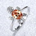 Silver turtle ring featuring a faceted orange gemstone shell and micro-pave crystals - Champagne Rhinestone