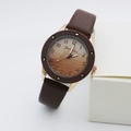 Detail of quartz watch featuring wavy textured brown dial and rose gold case with numeric markers - Coffee