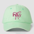 Detailed view of Pray lettering and pink bow print on mint green cotton baseball cap - One Size / Light Green