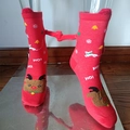 Detail showing red Christmas socks with 3D reindeer and magnetic doll hands on leg model - Red Reindeer Hand Holding