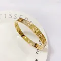 Polished golden stainless steel bangle with embossed anchor chain pattern - 357 Gold Bangle (357 Gold)