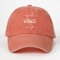 Close-up of good ViBeS only slogan on washed coral cotton baseball cap fabric - One Size / Orange