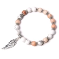 Retro beaded bracelet with white turquoise, sunstone beads and silver wing charm - Pink Aventurine