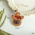 Gingerbread man ornament with blue apron and red bow for Christmas tree decoration - Apron Gingerbread Man