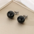 Macro shot of faceted black crystal stud earrings with polished silver steel posts - 10mm / Steel Base Black Faceted Crystal (KE116385-K)