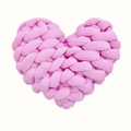 Macro detail of hand-knitted light pink heart cushion with soft woven texture - Pink