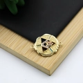 Detail of 18K gold-plated Hamsa Hand connector with colorful zircon on wood background - Hamsa Hand
