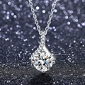 Macro shot of a brilliant moissanite pendant with a four-prong setting and pavé accents - Q005 Curve Accent 1ct