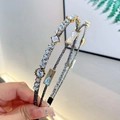Cerchietto doppio strato con cristalli scintillanti e incastonatura geometrica dorata - Bianco Grigio Argento