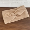Minimalist beige ribbed knit sports headband featuring a twisted knot design - Khaki
