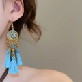 Detail of bohemian gold earrings with blue tassels and metallic feather pendants - 25# Earring Hook - Gold - Blue - Flower