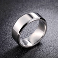 Macro detail of a silver titanium steel ring featuring polished beveled edges and glossy finish - US 6 / 8mm / Silver