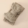 Detail view of beige textured oversized bow headband made of high elastic bubble fabric - Khaki