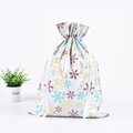 White Christmas drawstring gift bag with multicolored snowflake patterns and white ribbon - 51*39 Snowflake