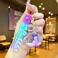 Macro detail of Kuromi liquid quicksand keychain with purple sequins and rubber strap - Gradient Strap Earphone Rabbit White Character