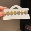 Close-up of a silver bracelet featuring six oval yellow gemstones and zircon accents - 32# Bracelet - Silver - Yellow