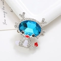 Macro shot of silver dragon charm with blue gemstone and crystal inlay on a white card - Silver Base Blue (D2267)