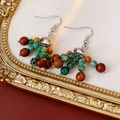 Detail view of bohemian wood and turquoise bead cluster earrings on a vintage background - Ear Hook-Silver-Green