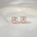 Macro detail of square princess cut stud earrings in rose gold with halo crystal setting - Rose Gold + Clear Zirconia