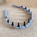 Blue knit headband with colorful flecks and eleven black spiked accents on top - Mixed Color Handmade Style / Blue