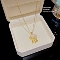 Titanium steel necklace in gold finish featuring a Ruyi lock pendant with cat eye stone - X239 Gold Cat-eye Ruyi Lock