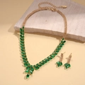 Macro shot of green wheat pendant necklace and earrings set on natural stone base - Necklace-Earring Two-Piece Set / Green