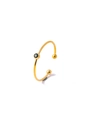 Detail of C-shaped open gold ring with a bezel-set round green gemstone and bead accents - Green