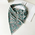 Detail of green floral cotton triangle headscarf with elastic band on white background - Green Floral