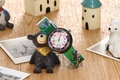 Kids quartz watch with green dinosaur strap and colorful easy-read dial on wooden table - Dinosaur