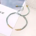 Adjustable mint green woven Milan cord bracelet with gold beads and sliding knot - Light Gray
