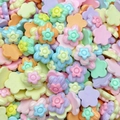 Macro shot of colorful resin flower beads in mixed pastel colors for jewelry making - Woven Pattern Flower