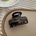 Detail of dark coffee acrylic hair claw clip with golden Barrette la France text - 5.5cm / Pearly Brown